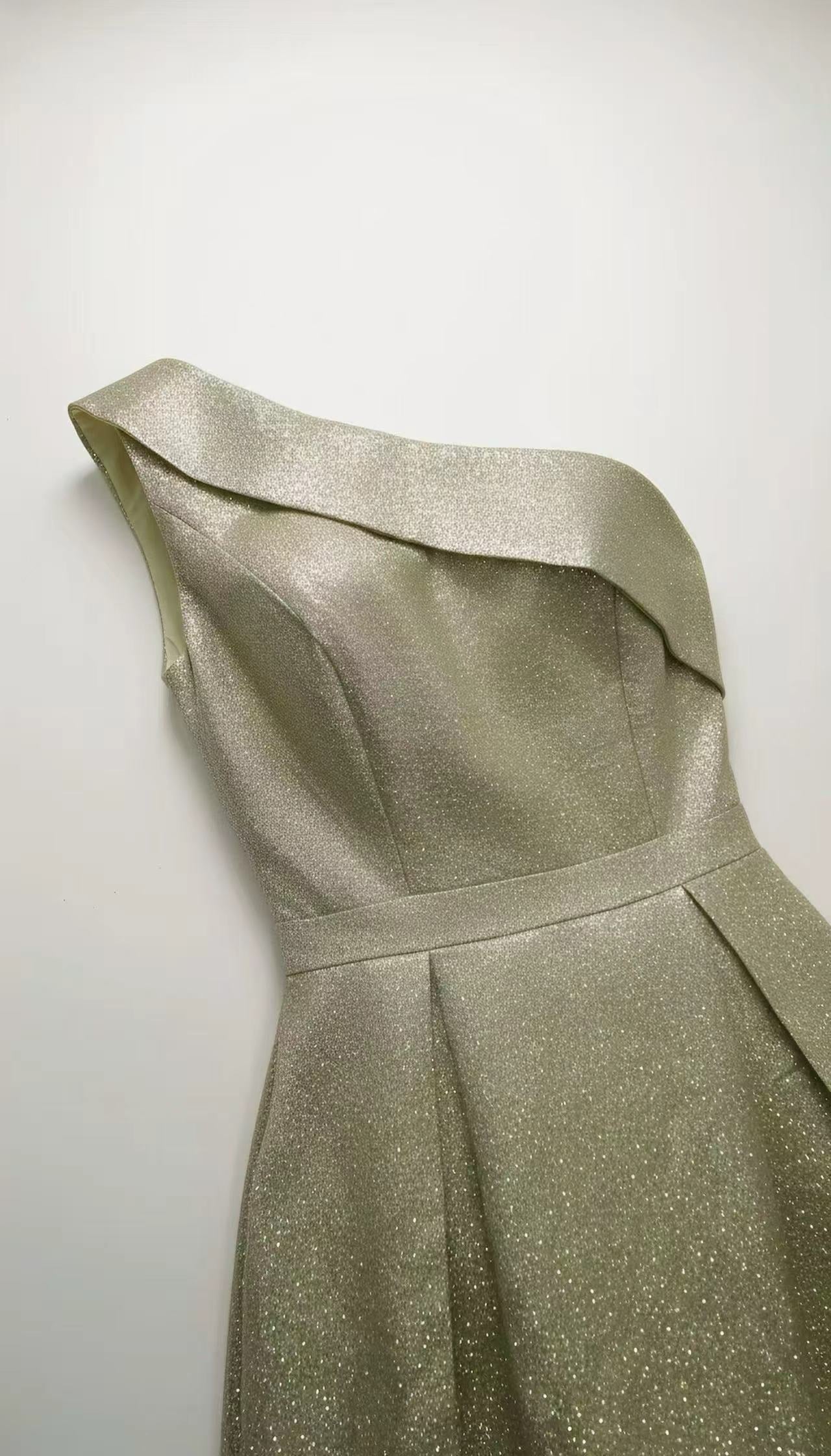 A single-shoulder, shiny, fitted, mid-length Dress