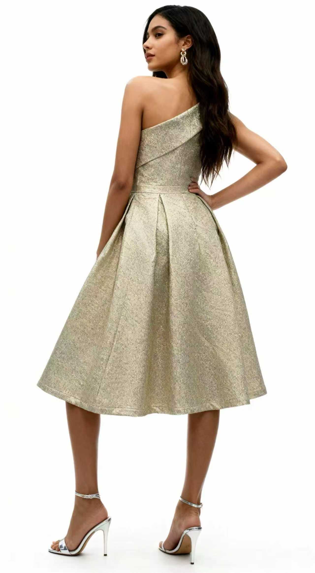 A single-shoulder, shiny, fitted, mid-length Dress